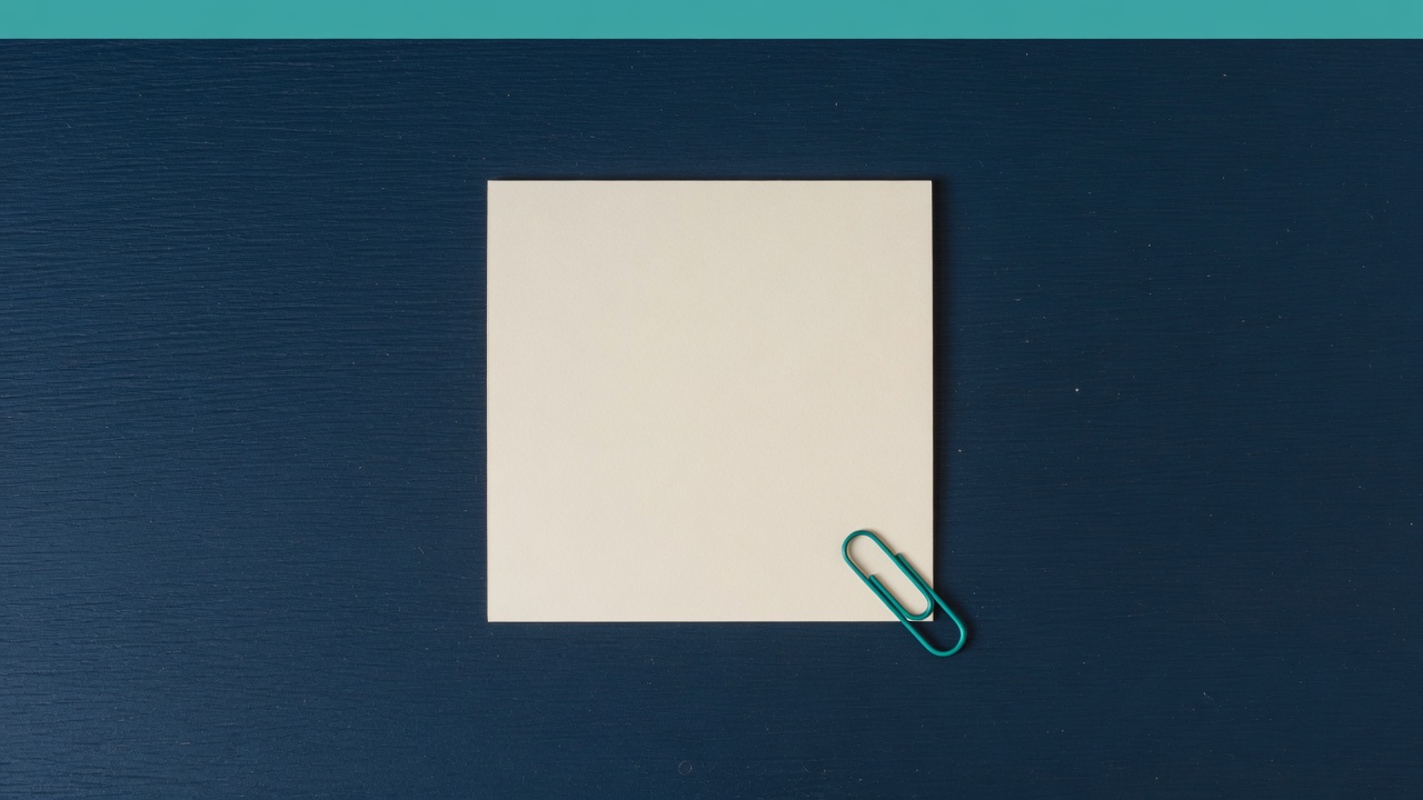 Cream stationery and a teal accent on a dark navy desk