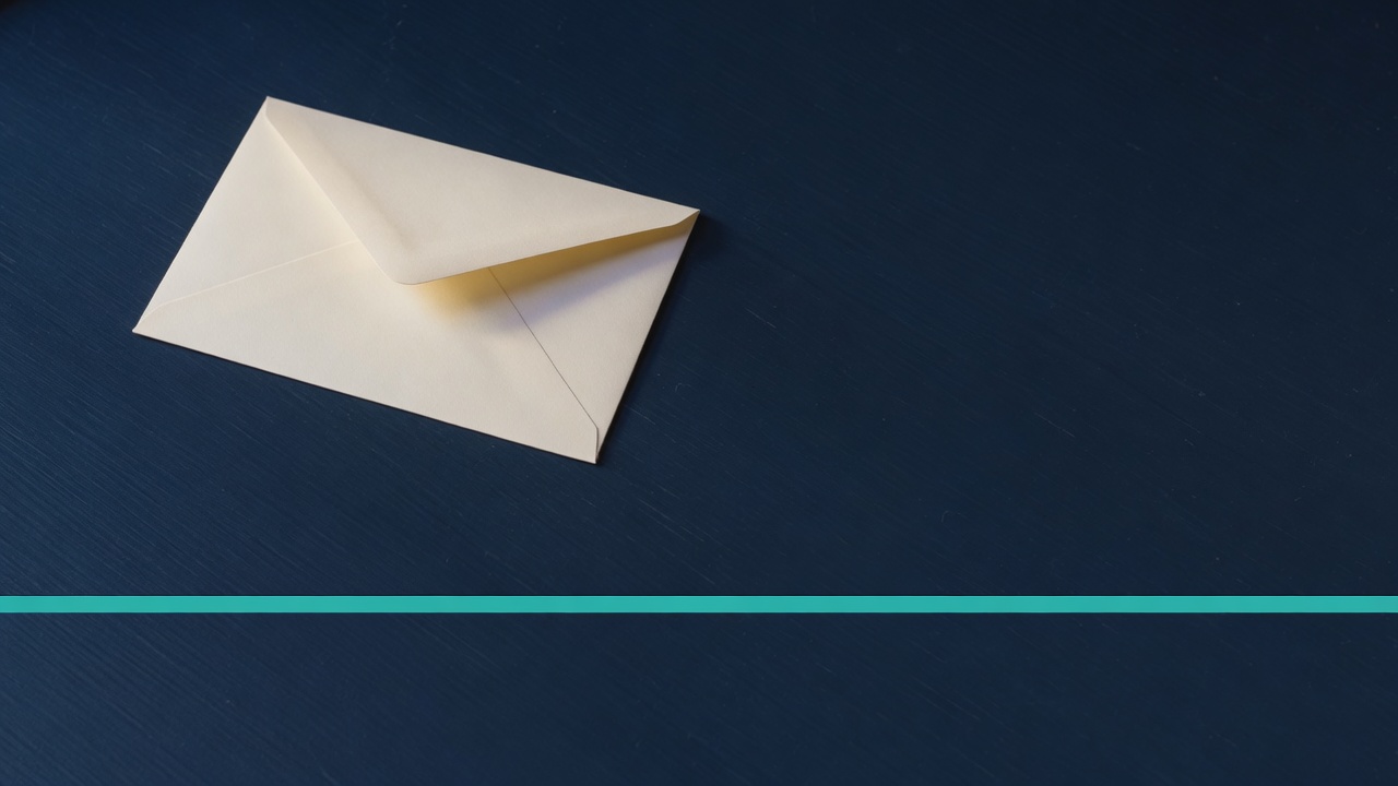 Cream stationery and a teal accent on a dark navy desk
