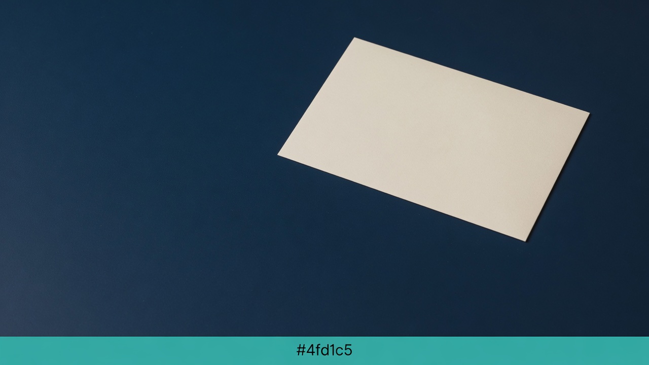 Cream stationery and a teal accent on a dark navy desk