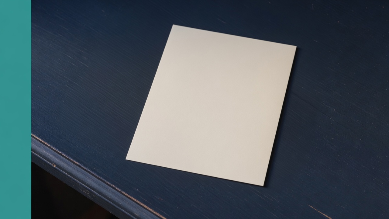 Cream stationery and a teal accent on a dark navy desk