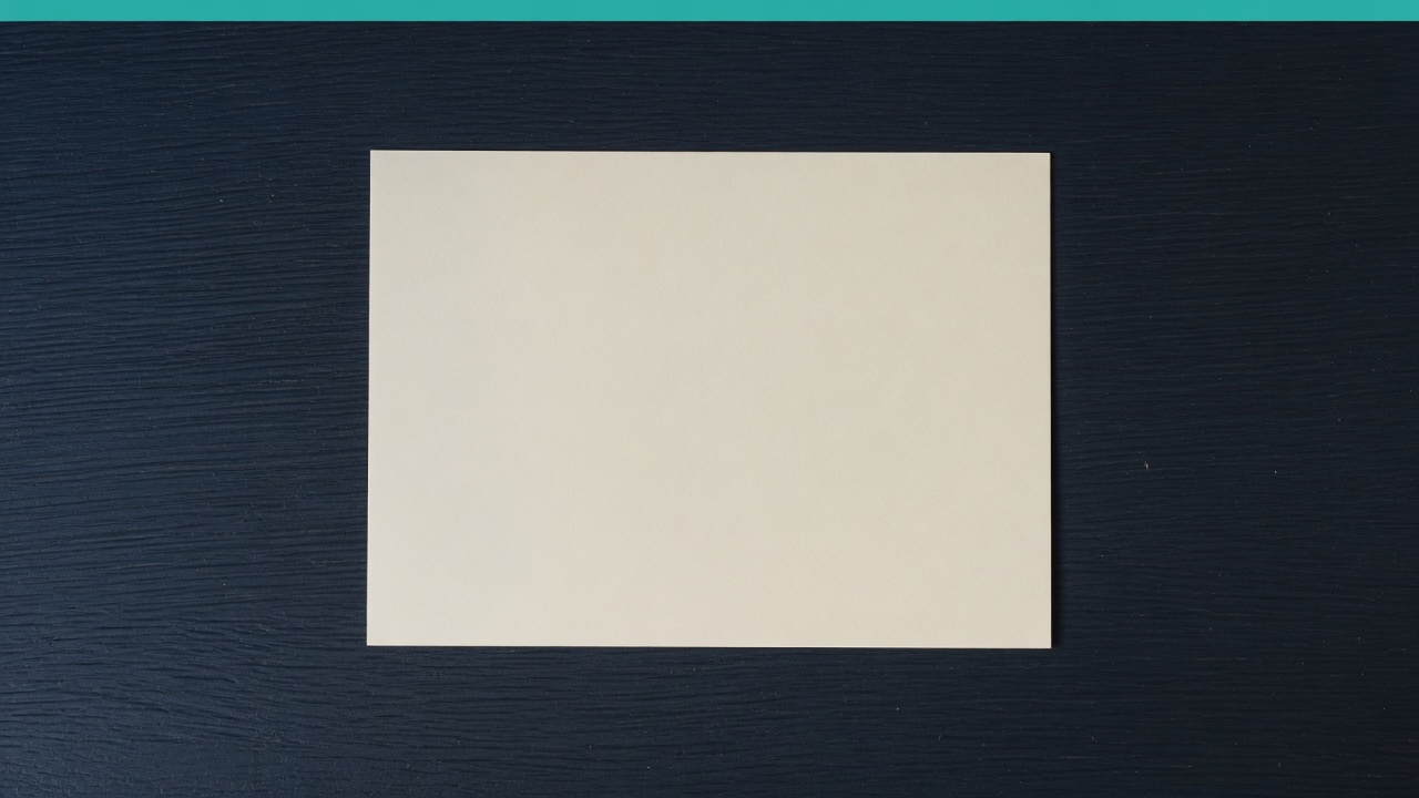 Cream stationery and a teal accent on a dark navy desk